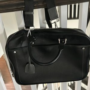 Black vinyl laptop bag with adjustable strap